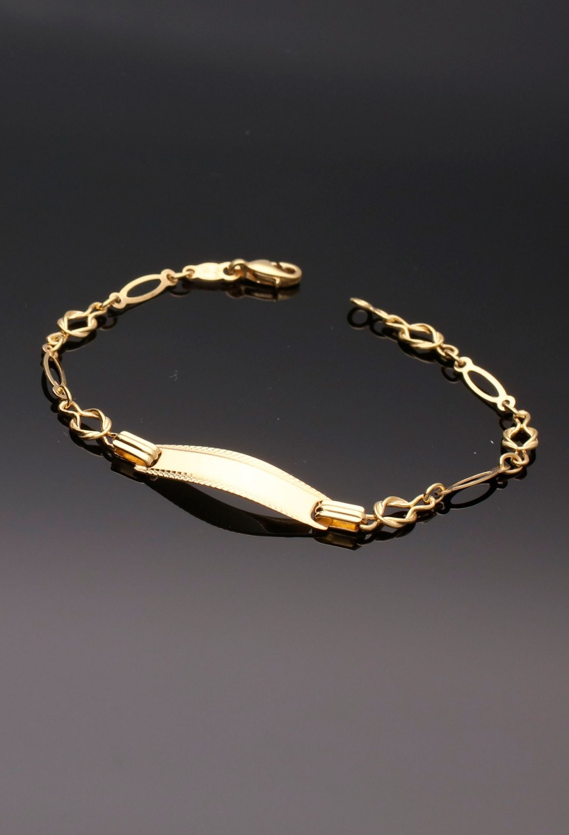pulsera oro amarillo 18 ktes con chapa para grabar foto sin recortar fondo negro
