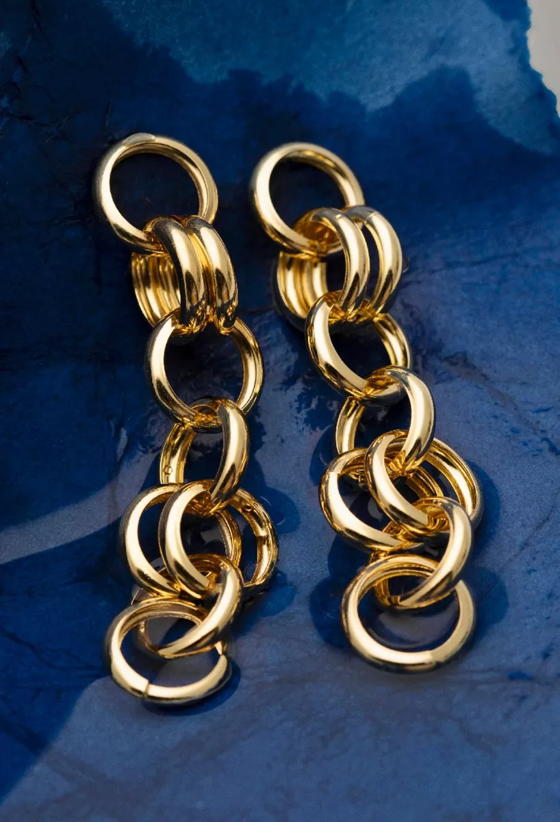 Pendientes de plata chapada con forma de círculos 273_A4355-DT fondo azul