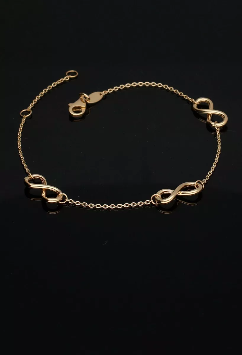 Pulsera de oro 18 ktes con infinitos y cadena eslabón forzado 243_401-00848 fondo negro